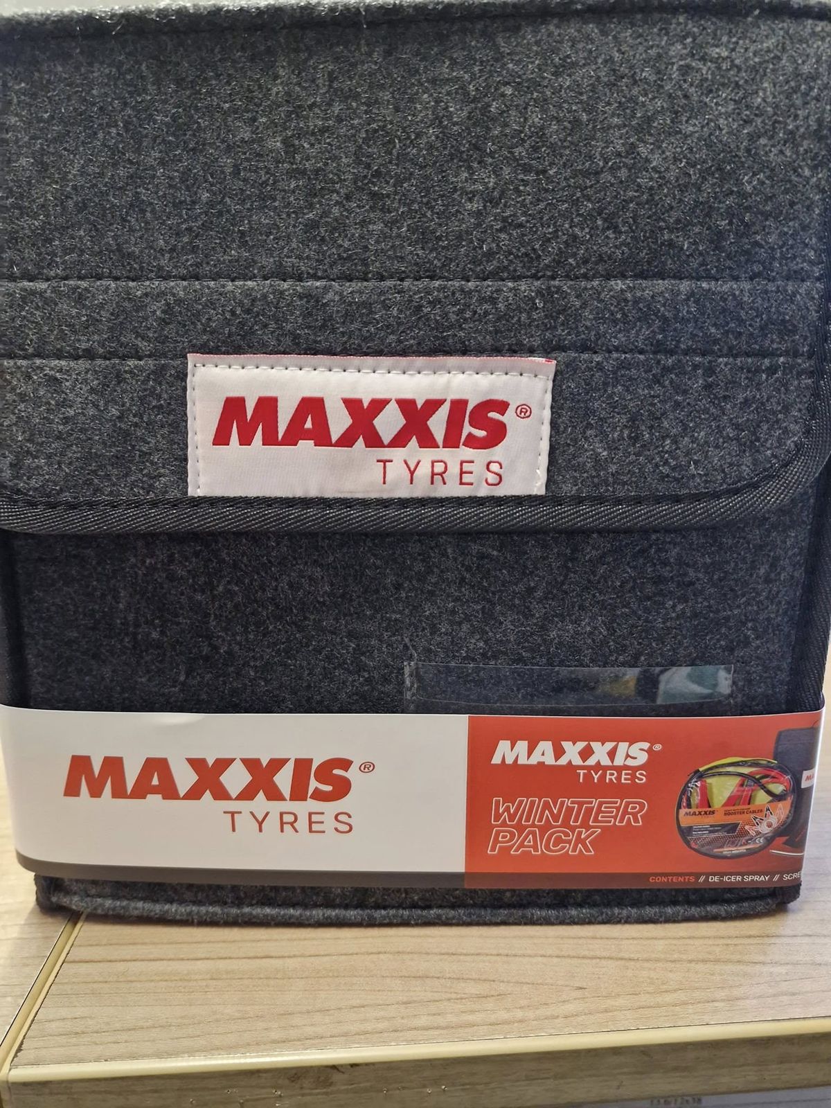 A Maxxis Tyres winter pack on the counter